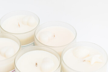 Many soy wax candles together on the white background