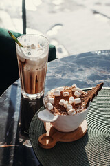 Dessert tiramisu with marshmallows in cup. European dessert in cafe.