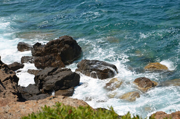 Fototapeta na wymiar Mediterranean coast. Beaches full of rocks. Islands and beaches in the Aegean Sea.