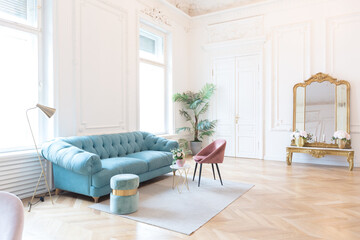 chic spacious light room in an old mansion in the classical style of the 19th century with a high...