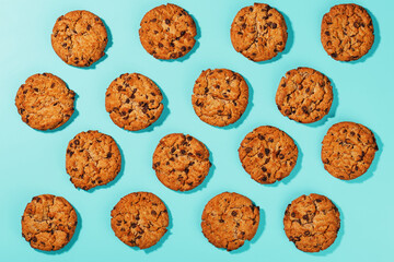 Oatmeal cookies with chocolate chip pattern and patterns on a light blue background.
