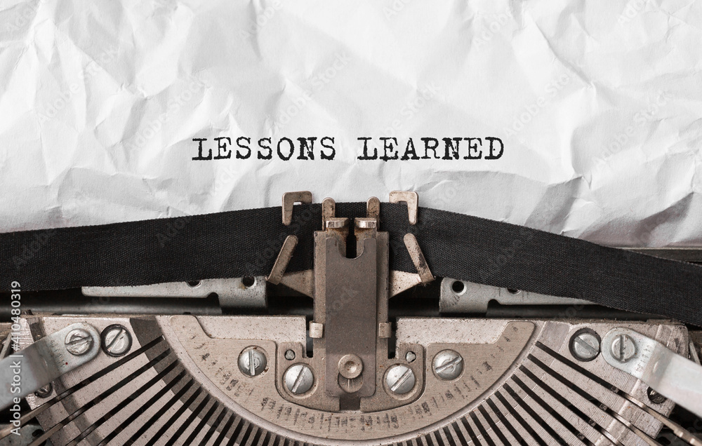 Poster text lessons learned typed on retro typewriter