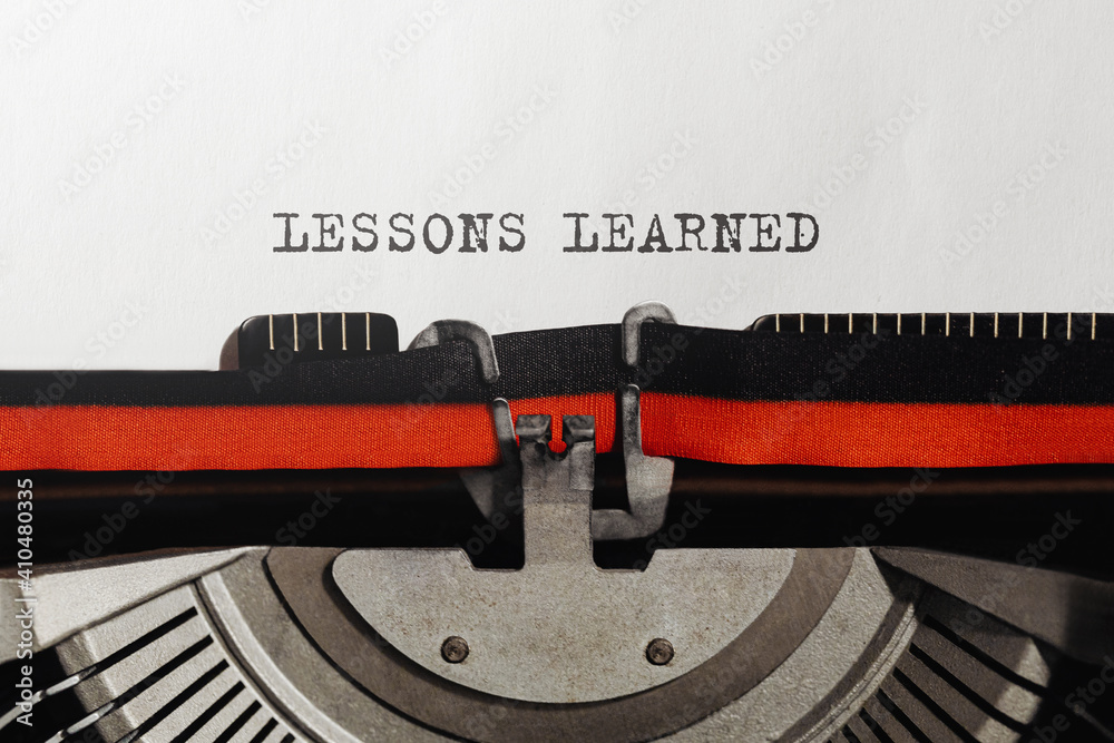 Poster text lessons learned typed on retro typewriter