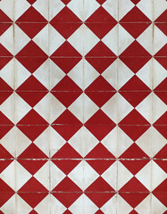 Geometric floor background with red and white rhombuses. Red and white retro square tiles. Closeup...
