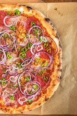 Pizza with Onion,Pepper , Salami  and Cheese. Top Down Overhead View. Restaurant Gourmet Food. Close Up View