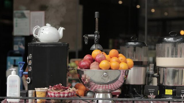 Entrance of a cafe in Istiklal street, Istanbul. Fruits and famous Turkish winter drink '' sahlep '' prepared for customers.