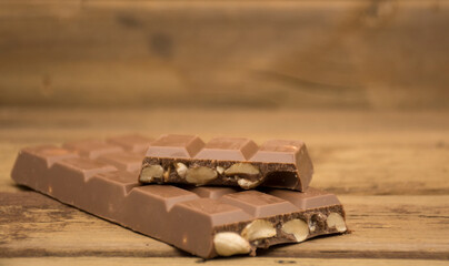 Chocolate bar with peanuts inside.