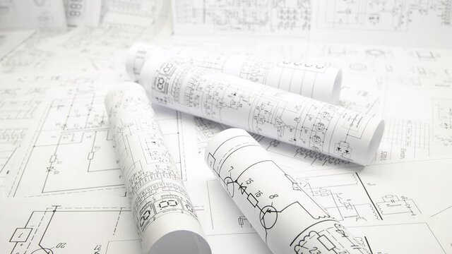 Paper electrical engineering drawings. Work of an electronic engineer.