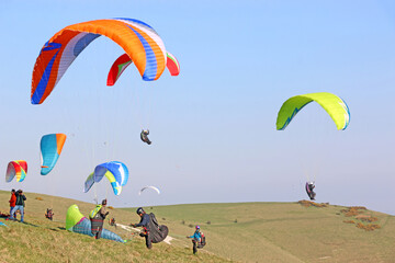Paragliders launching at Milk Hill, Wiltshire