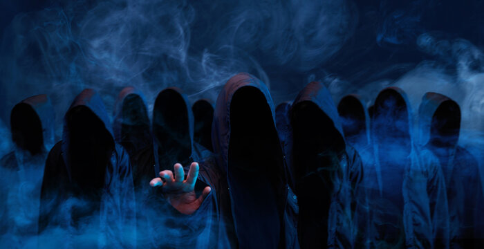 Hackers army. Dangerous hooded group of hackers. Internet, cyber crime, cyber attack, system breaking and malware concept. Dark face. Anonymous. Abstract smoke moves on black background. - Powered by Adobe