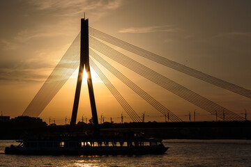 Fototapeta na wymiar cable stayed bridge silhouette at sunset