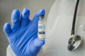Fototapeta premium medicine vaccine in a bottle in the doctor's hand for coronavirus pneumonia disease
