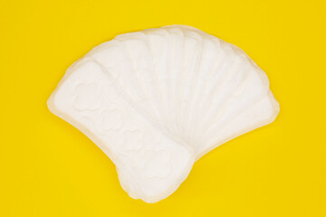 sanitary napkin or sanitary pad for intimate hygiene on a yellow background