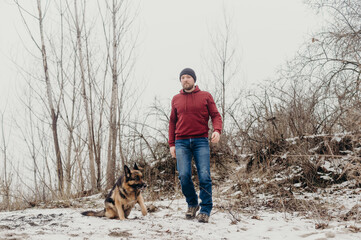 Owner man having fun with best friend german shepherd.