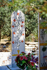 old grave stone with floral painting