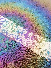Obraz premium Oil Petrol Pollution Rainbow Gasoline Leak on Pavement