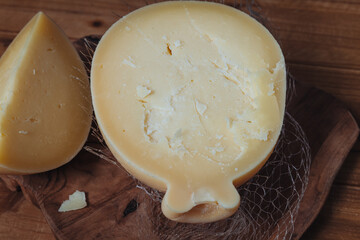 Delicious Caciocavallo cheese on a wooden board