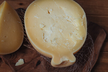 Delicious Caciocavallo cheese on a wooden board