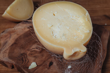 Delicious Caciocavallo cheese on a wooden board