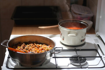 Cooking tomato, vegetable and minced meat sauce at home. Selective focus.