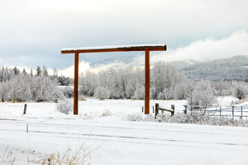 rural ranch entrance in winter after a fresh snowfall, northwest Montana