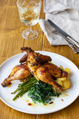 Roasted poussin with potatoes, mashed swede, green beans and creamy spinach