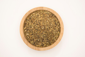 Crushed and dried basil leaves.