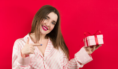 Young woman holding Gift box