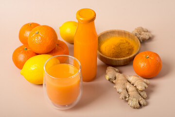 Ginger shot with citrus fruits juice, turmeric and honey.