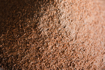 Small granules of crushed wheat close-up. Wheat background