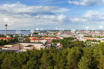 Fototapeta na wymiar Näsinneula observation tower and the city of Tampere, Finland, viewed from above on a sunny day in the summer. Wireless network connection, WiFi, smart city and online messaging concept. 