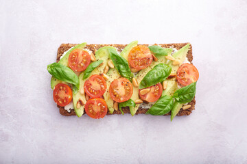 Sliced avocado on rye bread