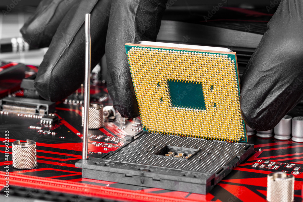 Aufkleber hand with cpu at installation of a computer processor into socket motherboard. pc hardware technolog