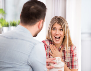 Man giviving gift to his girlfriend