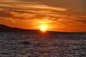 Orange sunset in the sea and reflection