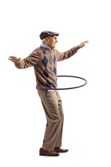 Full length profile shot of an elderly man spinning a hula hoop