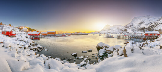 Stunning winter scenery of Moskenes village with ferryport and famous Moskenes parish Churc