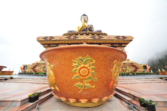 Water bowl in the background of the Buddha statue in Tathagata Tsal (Buddha park), Sikkim, India