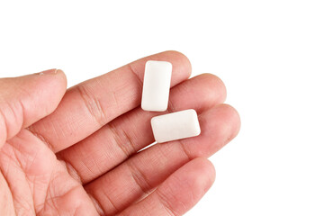 Mint chewing gum in hand isolated on white background with clipping path