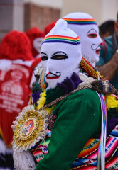 Man on a mask, participant at the wild Virgen del Carmen Festival, held in Pisac and Paucartambo, Peru