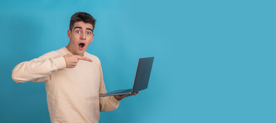 isolated surprised teenager or student with laptop