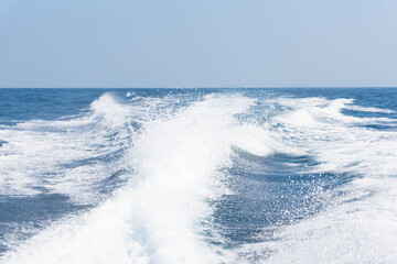 Vintage and retro toning of tropical beach with blue sky and clear sea which including of a wooden boat in sunrise time with vintage retro tone. Vacation time as concept.