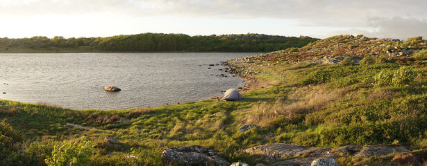 Wild camping at the beach on Styrsö Island at sunset near Gothenburg City in Sweden.
