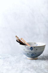 Traditional ceramic bowl on bright background. Copy space.