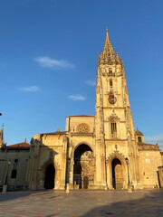 Fototapeta na wymiar Oviedo, Spain - September 4, 2020: The Metropolitan Cathedral Basilica of the Holy Saviour at sunset. Gothic cathedral located in the city of Oviedo, Asturias. It is also known as Sancta Ovetensis.