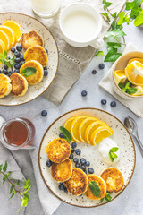 Delicious breakfast with curd fritter,  ricotta fritter or cottage cheese pancakes on ceramic plate. Gourmet healthy delicious morning breakfast