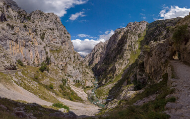 The Cares Route in the heart of Picos de Europa National Park, Cain-Poncebos, Asturias, Spain. Narrow and impressive canyon between cliffs, bridges, caves, footpaths and rocky mountains.
