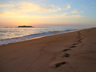Moledo beach sunset with ins fort and Trega mount