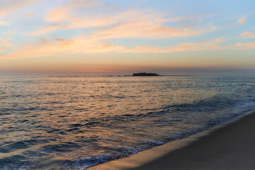 Fototapeta na wymiar Moledo beach sunset with ins fort and Trega mount