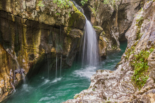 Small waterfall in Soca river gorge near Bovec village, Slovenia